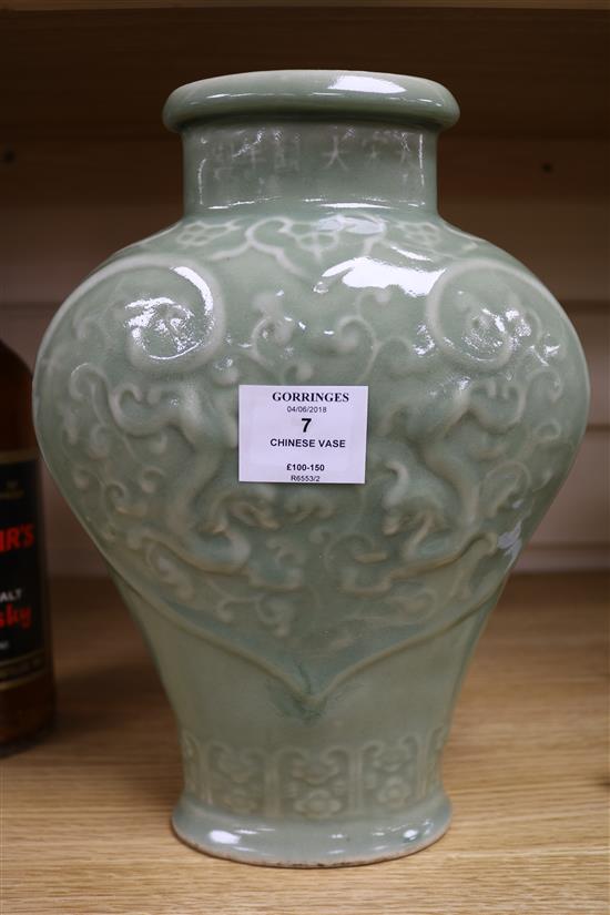 A Chinese celadon glazed vase height 18cm